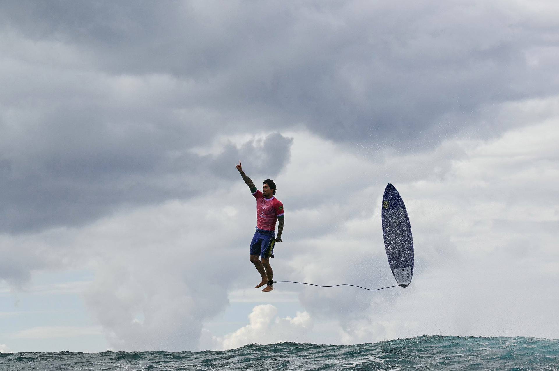Brazil's Gabriel Medina bursts out triumphantly from a large wave in the fifth heat of round three of men&rsquo;s surfing, during the 2024 Olympic Games, in Teahupo&rsquo;o, Tahiti, French Polynesia.